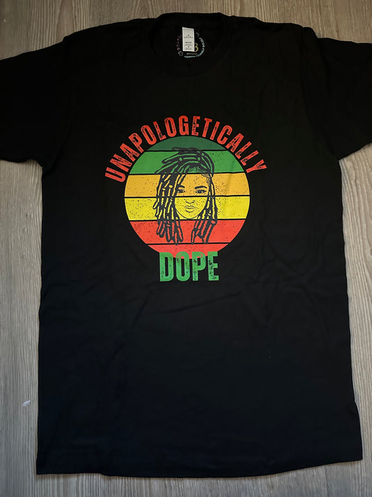 Unapologetically in Red text Dope in green text with green, orange, yellow, red retro circle with dreadlocks lady on top on a black shirt. Melanin Apparel. 